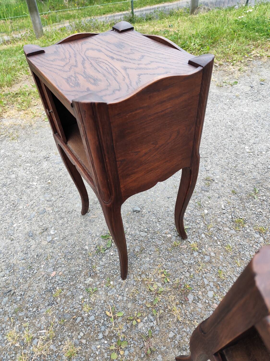 Pair of oak bedside tables with curtained niche doors