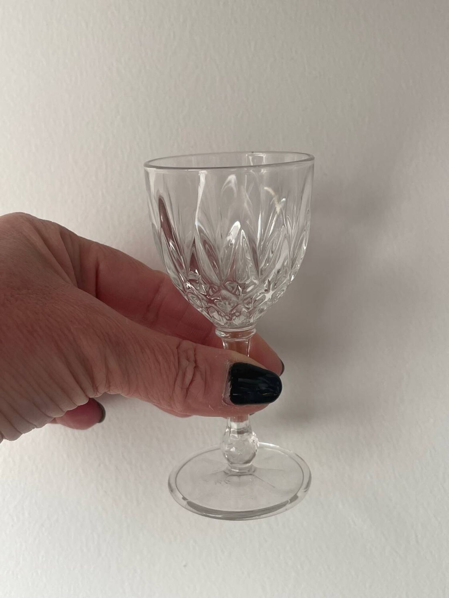 4 cut glass liqueur glasses on stems