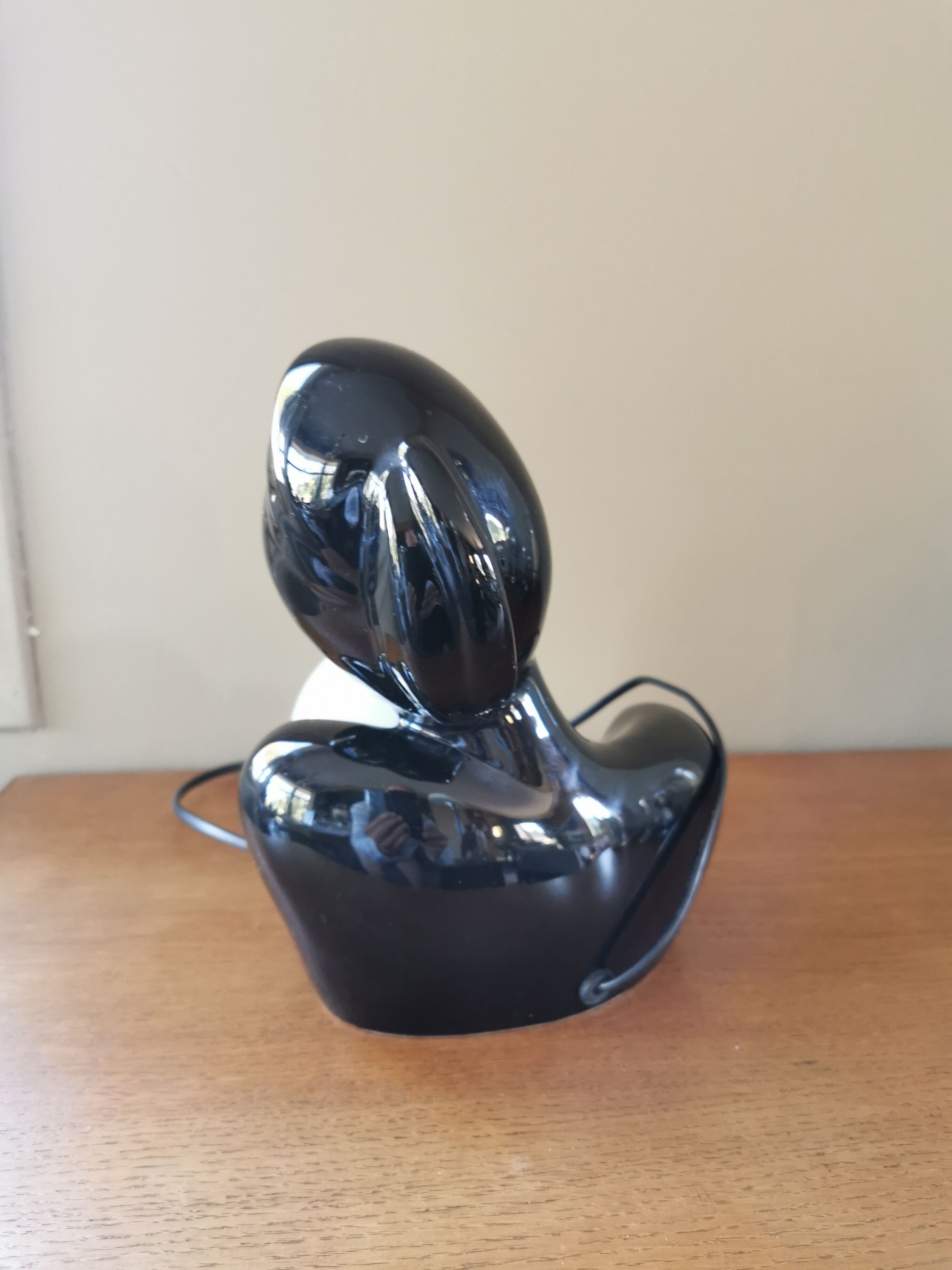 Vintage 80s lamp in the shape of a woman's bust made of black ceramic.