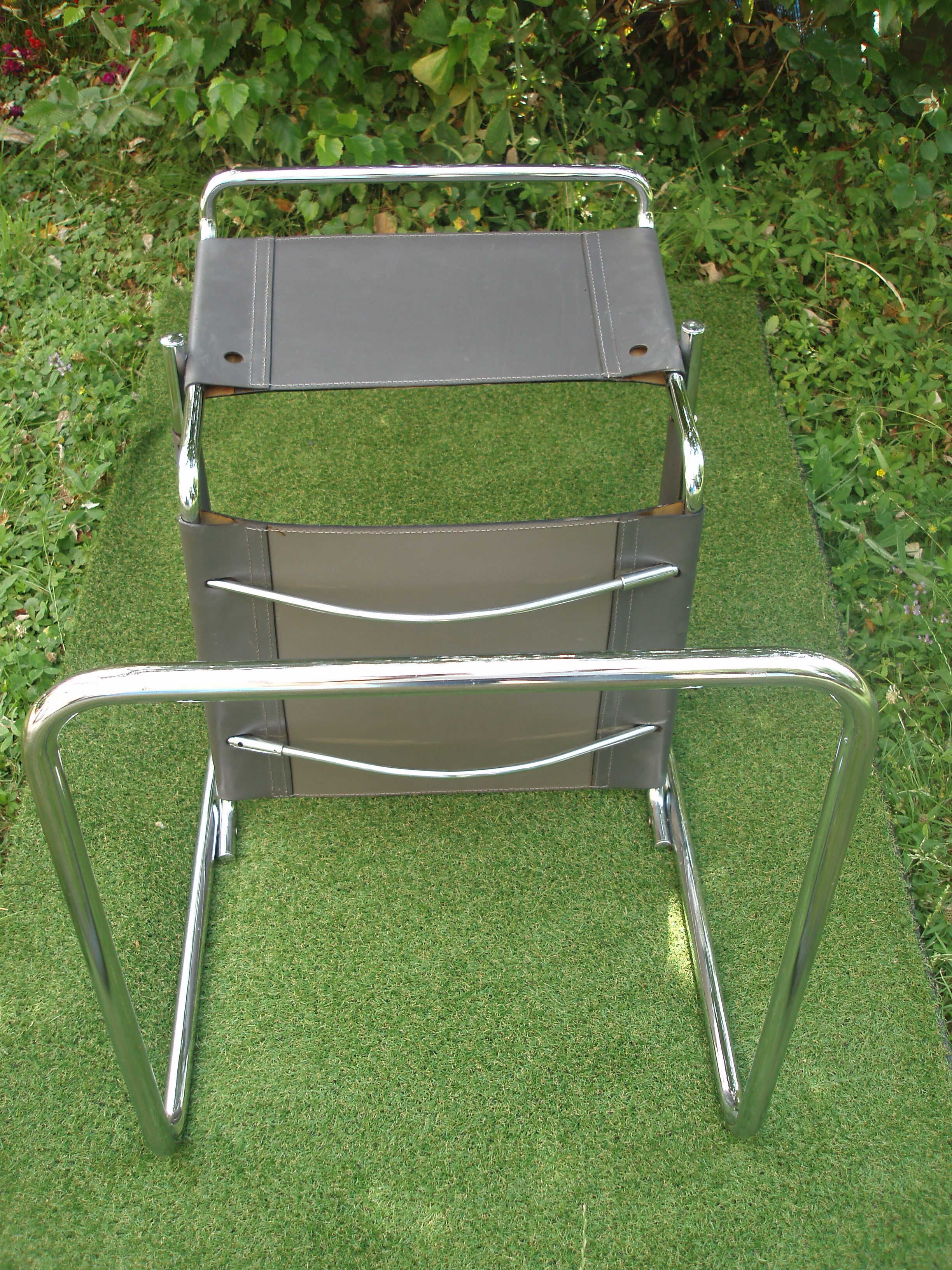 Series of grey and chrome leather armchairs