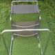 Series of grey and chrome leather armchairs