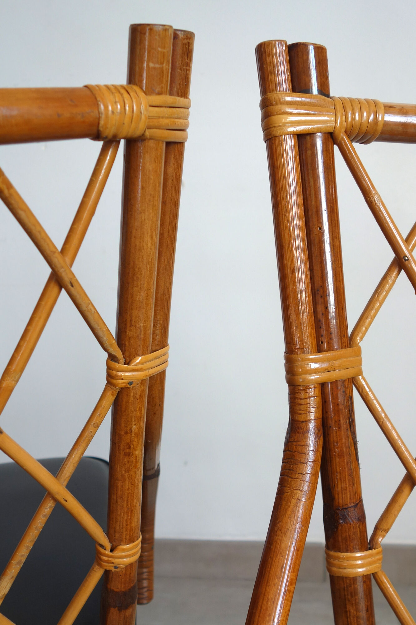 Pair of rattan and black skai bamboo chairs, 60s