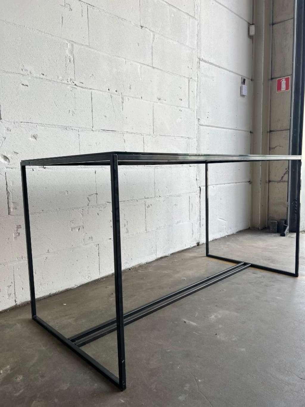 Coffee table in glass and iron