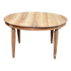 Art Deco round extendable dining table stripped in solid walnut from the 1920s.
