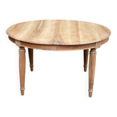 Art Deco round extendable dining table stripped in solid walnut from the 1920s.