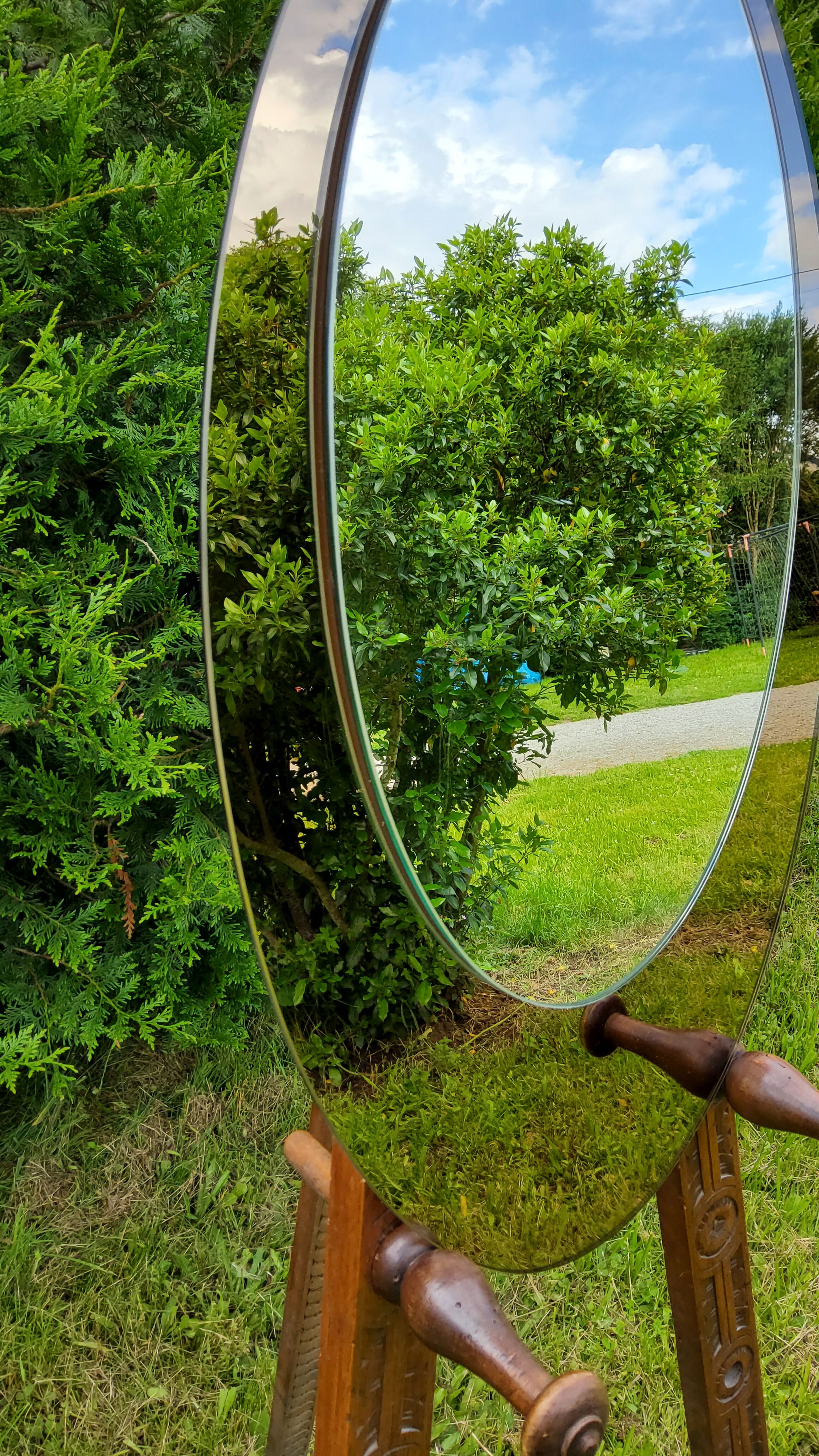 Oval Italian mirror of the 70s two complexions