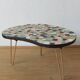 Unusual coffee table on three legs