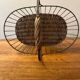 Small wicker and green metal basket