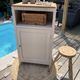 Beautiful art deco jam cupboard in delicate beige tone / and wicker basket
