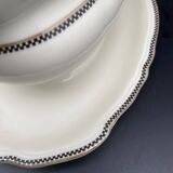 Porcelain sauce boat with black and gold checkered border