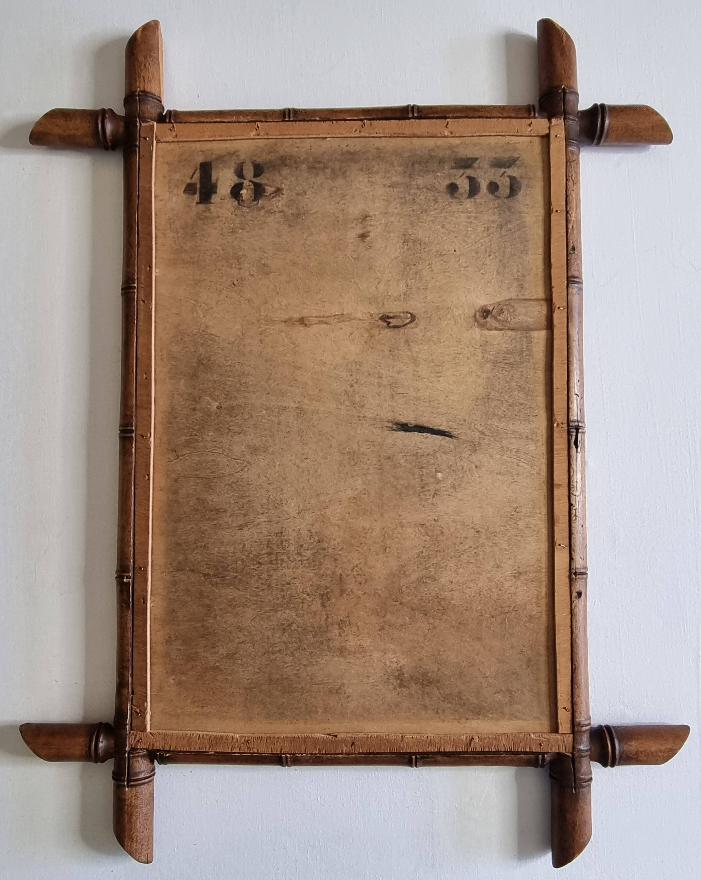 Miroir mural Napoléon III en bois tourné façon bambou XIXe siècle, 49x65 cm