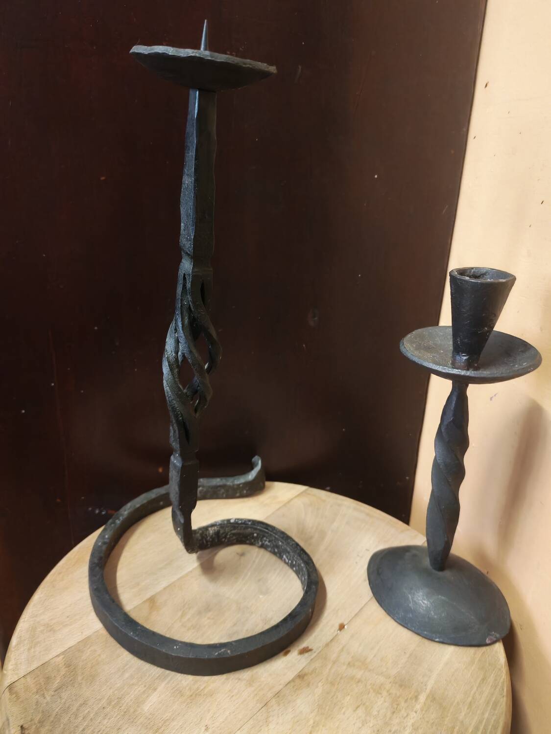 Set of 3 candlesticks and a candle holder in wrought iron.