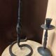 Set of 3 candlesticks and a candle holder in wrought iron.