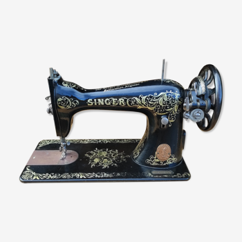 Old Singer sewing machine on pedestal