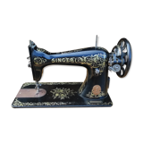 Old Singer sewing machine on pedestal