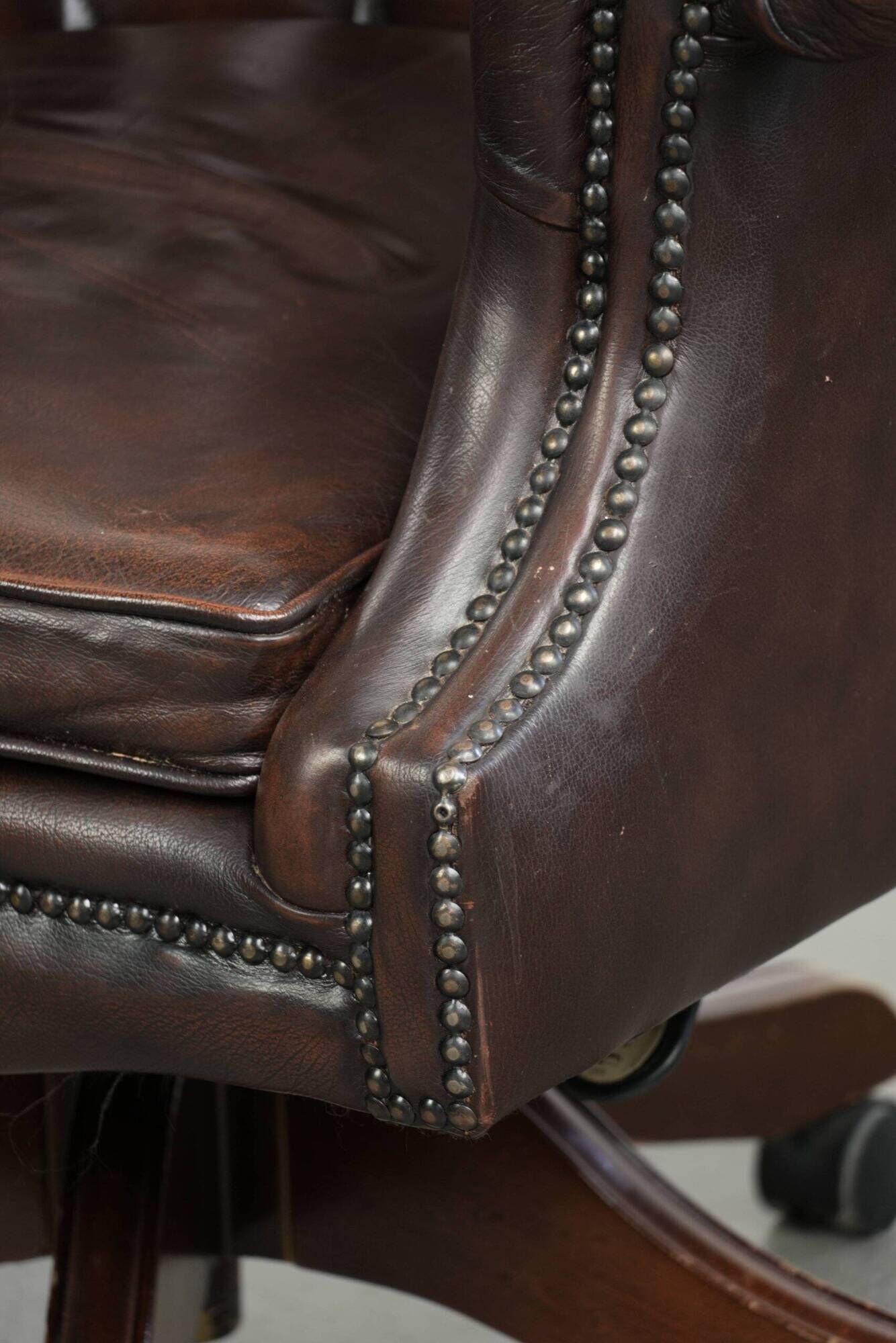 Brown cow leather Chesterfield office chair on wheels in English style