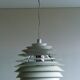 Large pendants from the early last century from the Louvre by Poul Henningsen for Louis Poulsen, 1962.