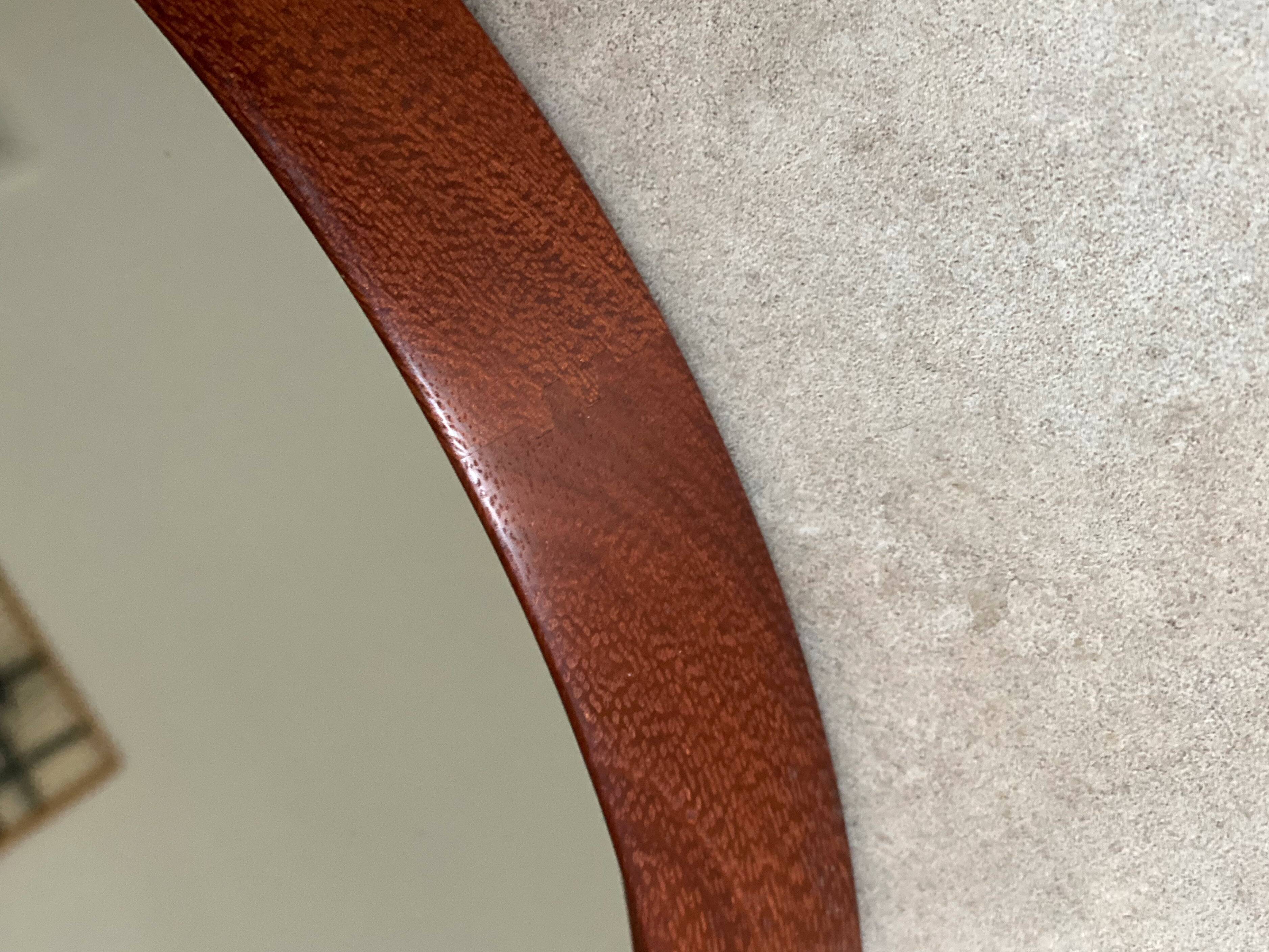 Mid Century solid teak wall mirror with a leather strap - Danish design