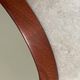 Mid Century solid teak wall mirror with a leather strap - Danish design