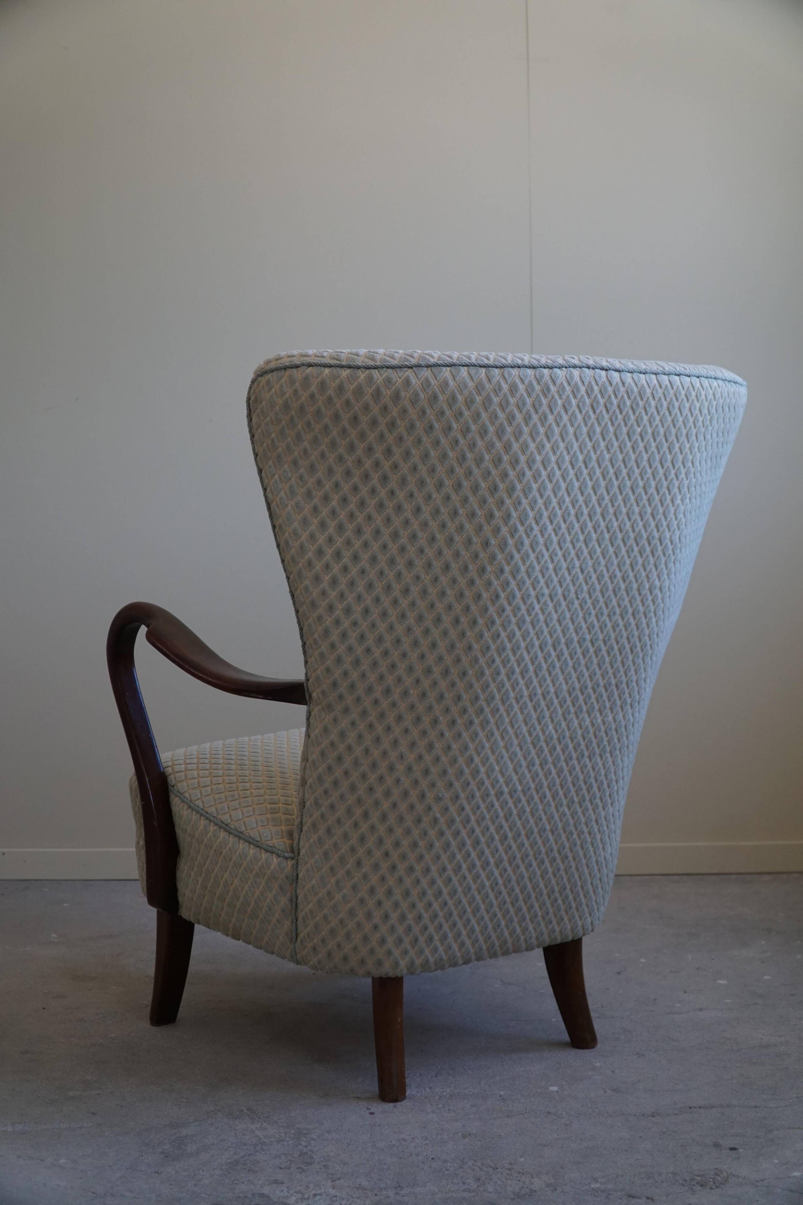 Slagelse Møbelfabrik, modern Danish lounge armchairs with beech footrests, 1960s.