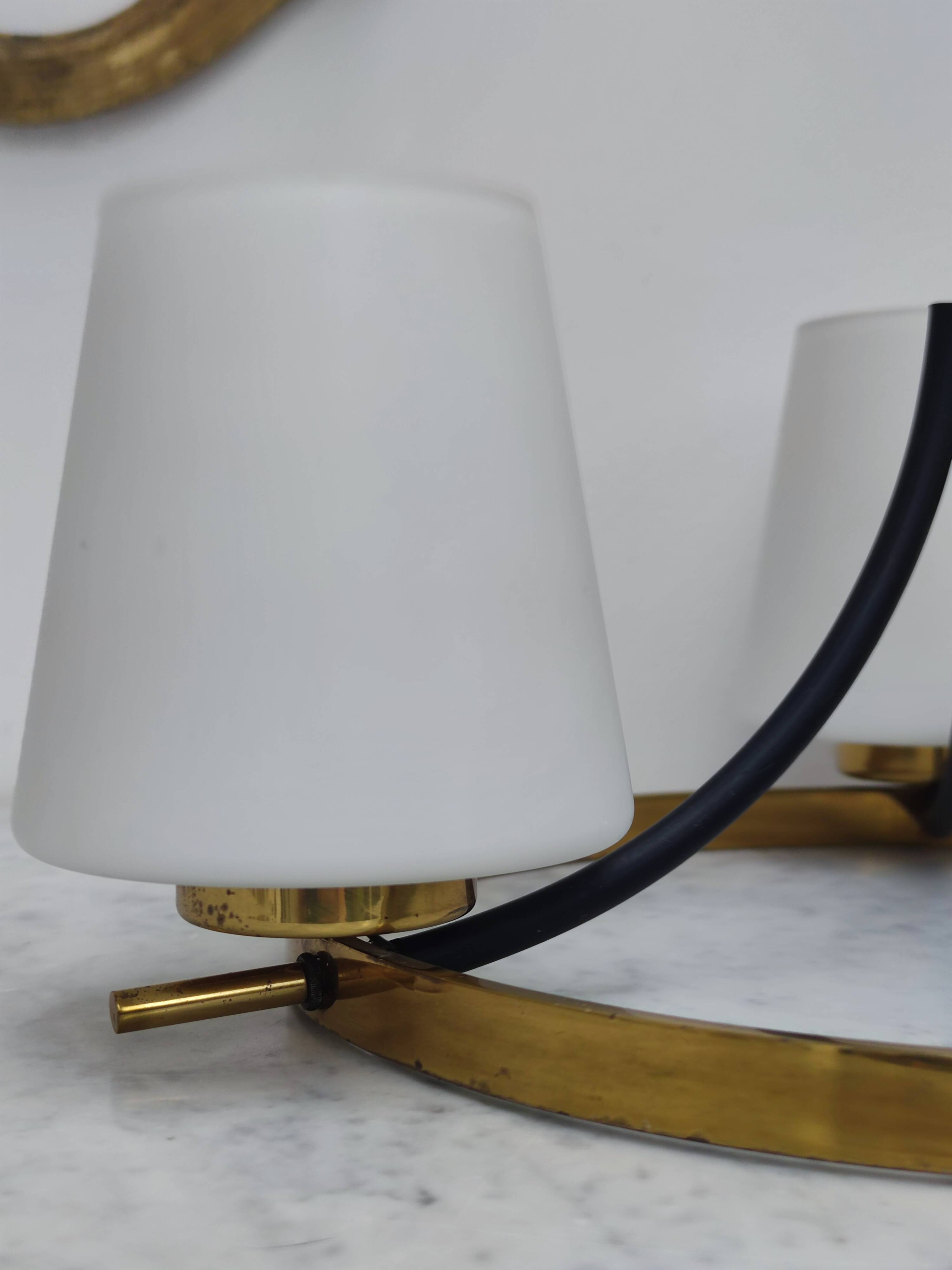 Brass chandelier and white opalines