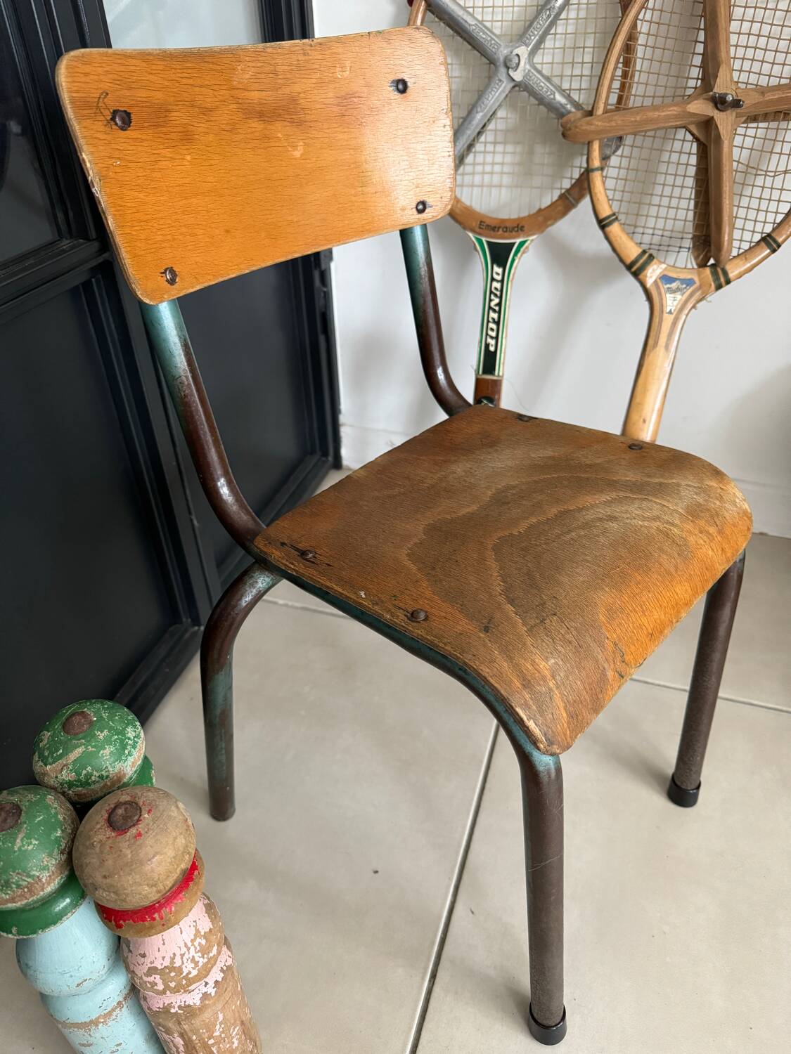 Old wooden and metal children's school chair