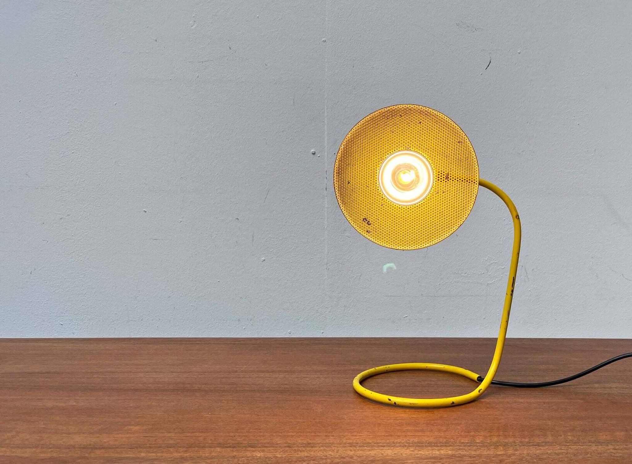 Perforated metal table lamp in Mid-Century Modern style, in the style of Mathieu Matégot, 1960s.