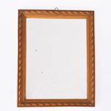 Small old wooden mirror with carved frame