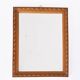 Small old wooden mirror with carved frame