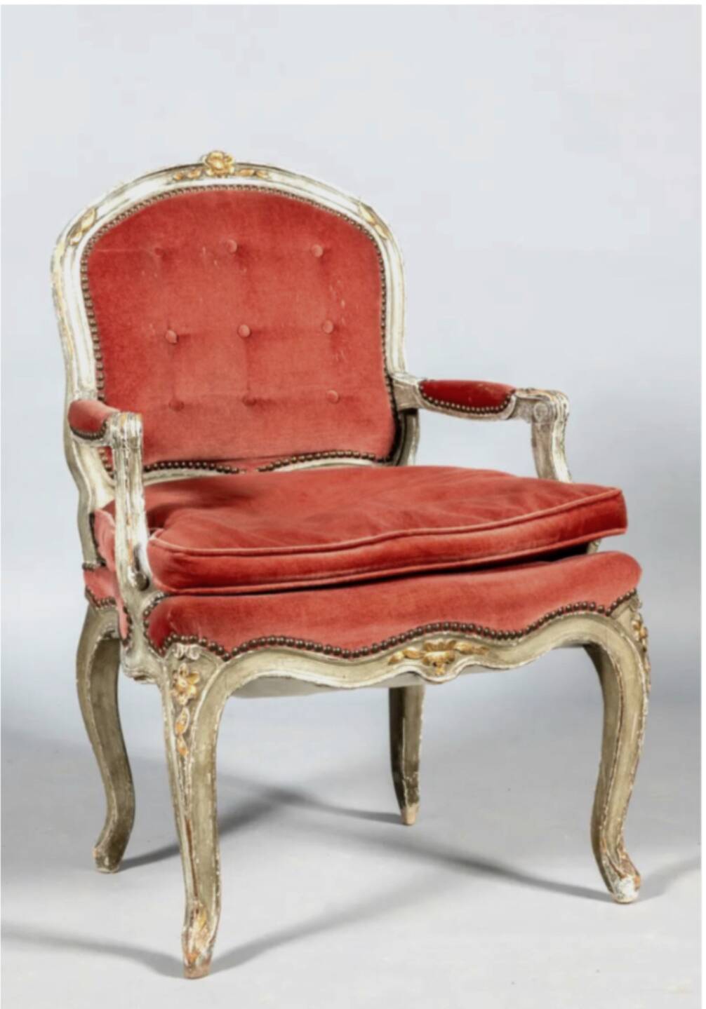 Louis XV style armchair in molded and carved wood with gray and gold patina