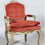 Louis XV style armchair in molded and carved wood with gray and gold patina