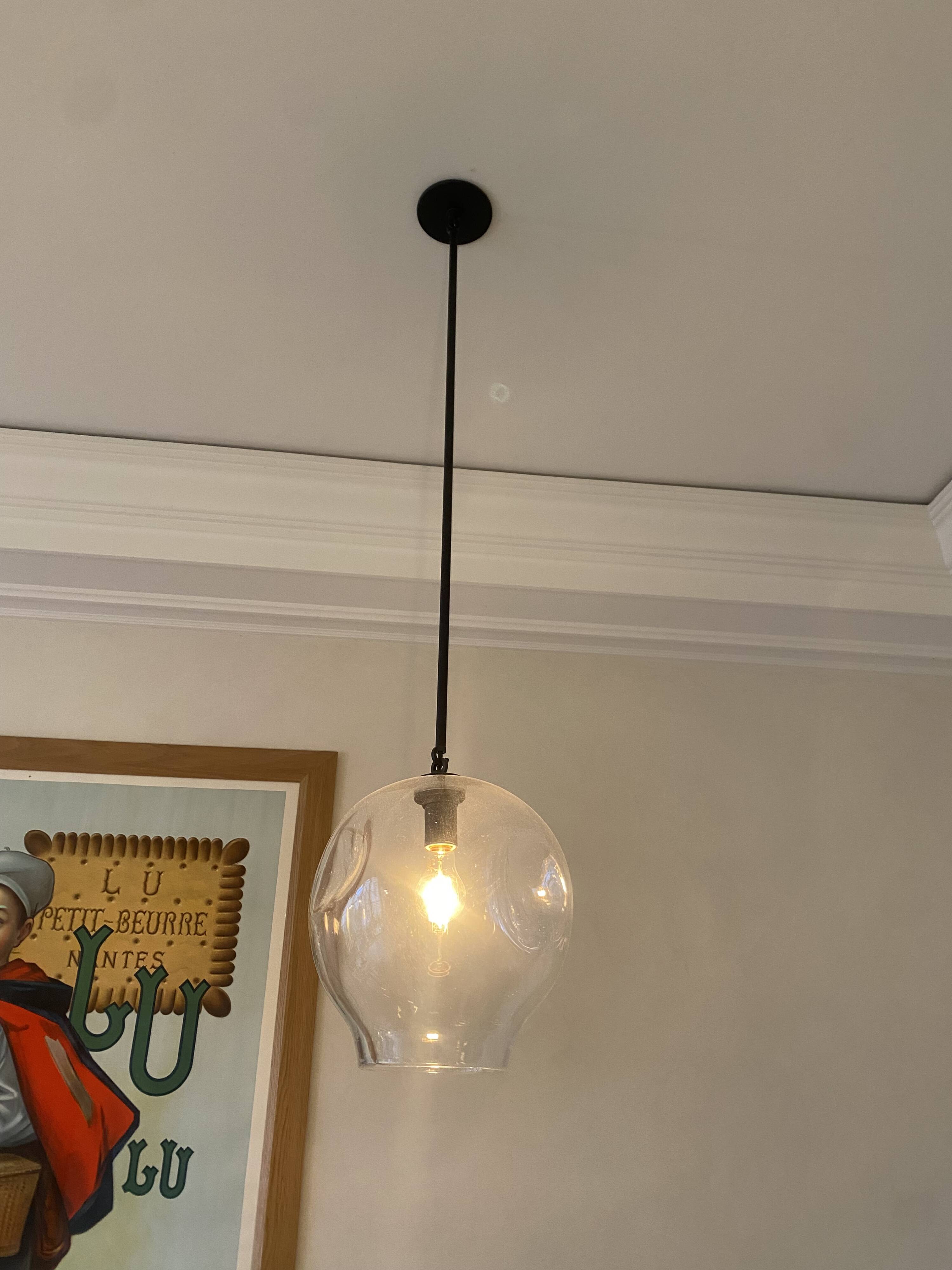 Suspension design by Lindsey Adelman studio in oil-rubbed bronze and clear glass.