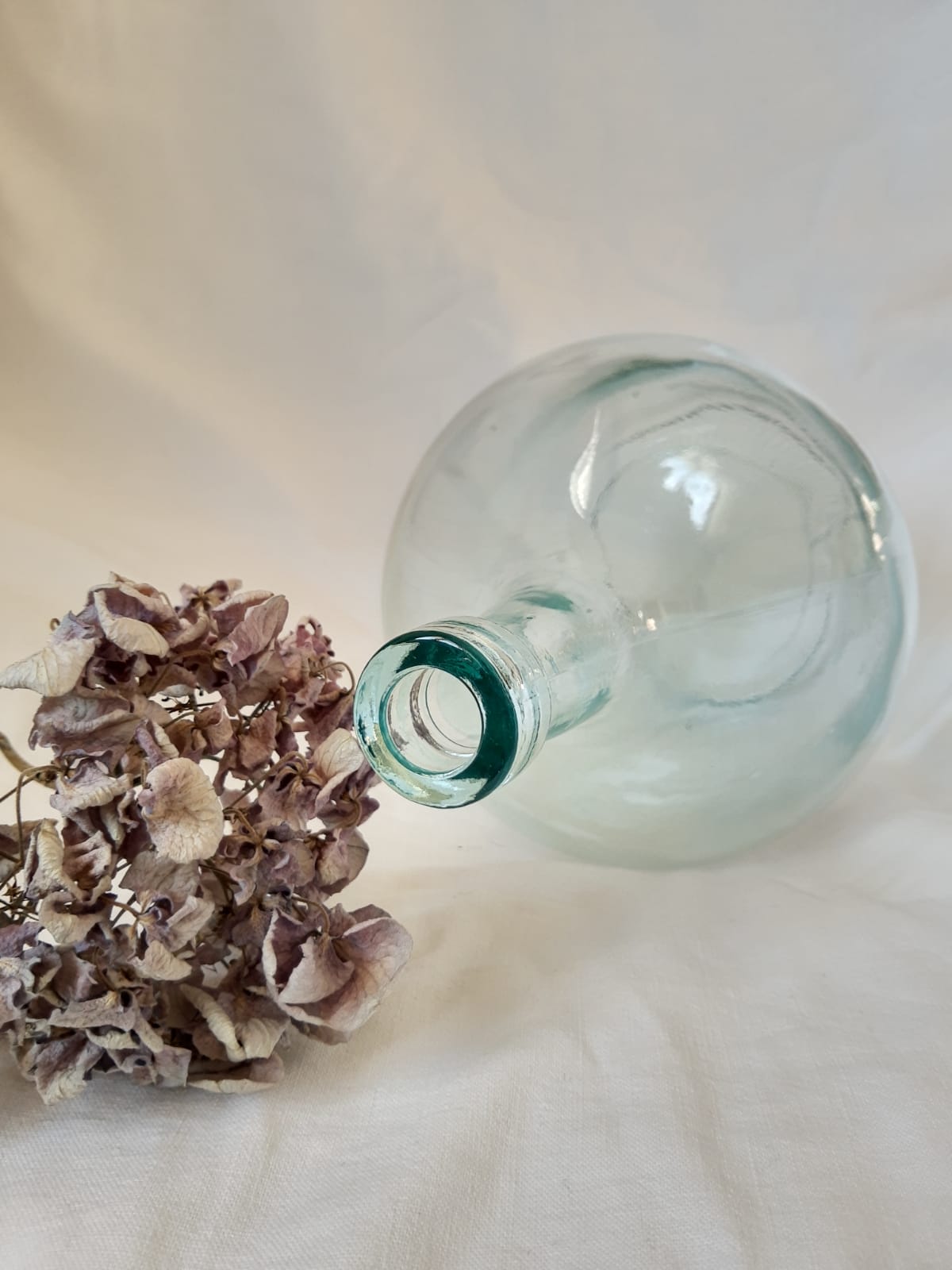 Demijohn in vintage transparent glass