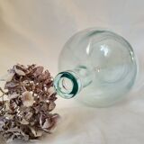 Demijohn in vintage transparent glass