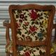 Convertible armchair with brocade fabric and floral patterns.