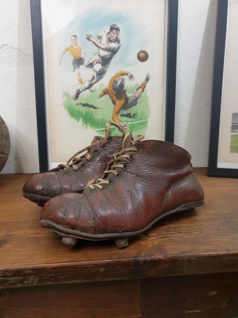 Pair of old football boots, vintage sport