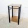 Vintage side table with two smoked glass tops and black metal.
