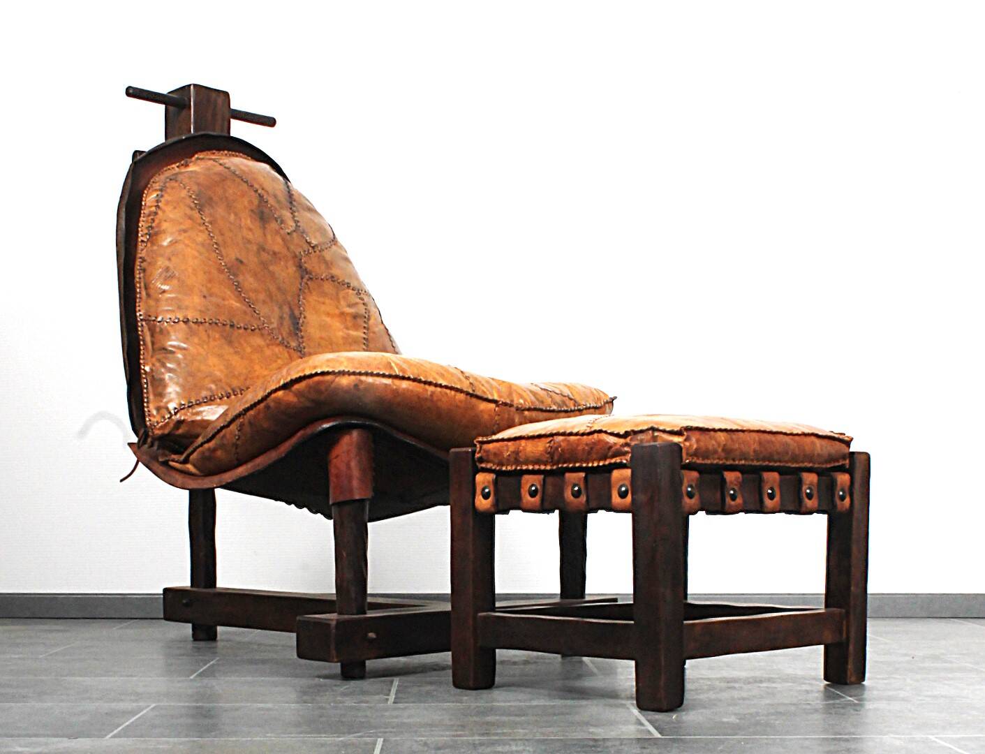 Brutalist oak lounge chair and ottoman, 1970s, set of 2