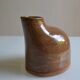 Bottle vase with an off-centre neck in ceramic, signature with a fish to be identified.