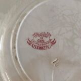 Old flat plate in Terre de Fer earthenware stamped Gien, Fleurette model.