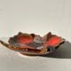 Empty Vallauris pocket in the shape of a leaf, orange and brown iced décor