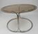 Dining table in chrome metal and smoked glass.