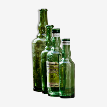 Lot de 4 bouteilles anciennes "L'Hermitage" eau d'arquebuse de Saint Genis Laval (Dept 69)