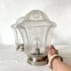 Pair of lantern-style ceiling lights or antique lamps.