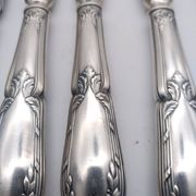 Set of 12 sfam knives in silver metal and stainless steel blades.