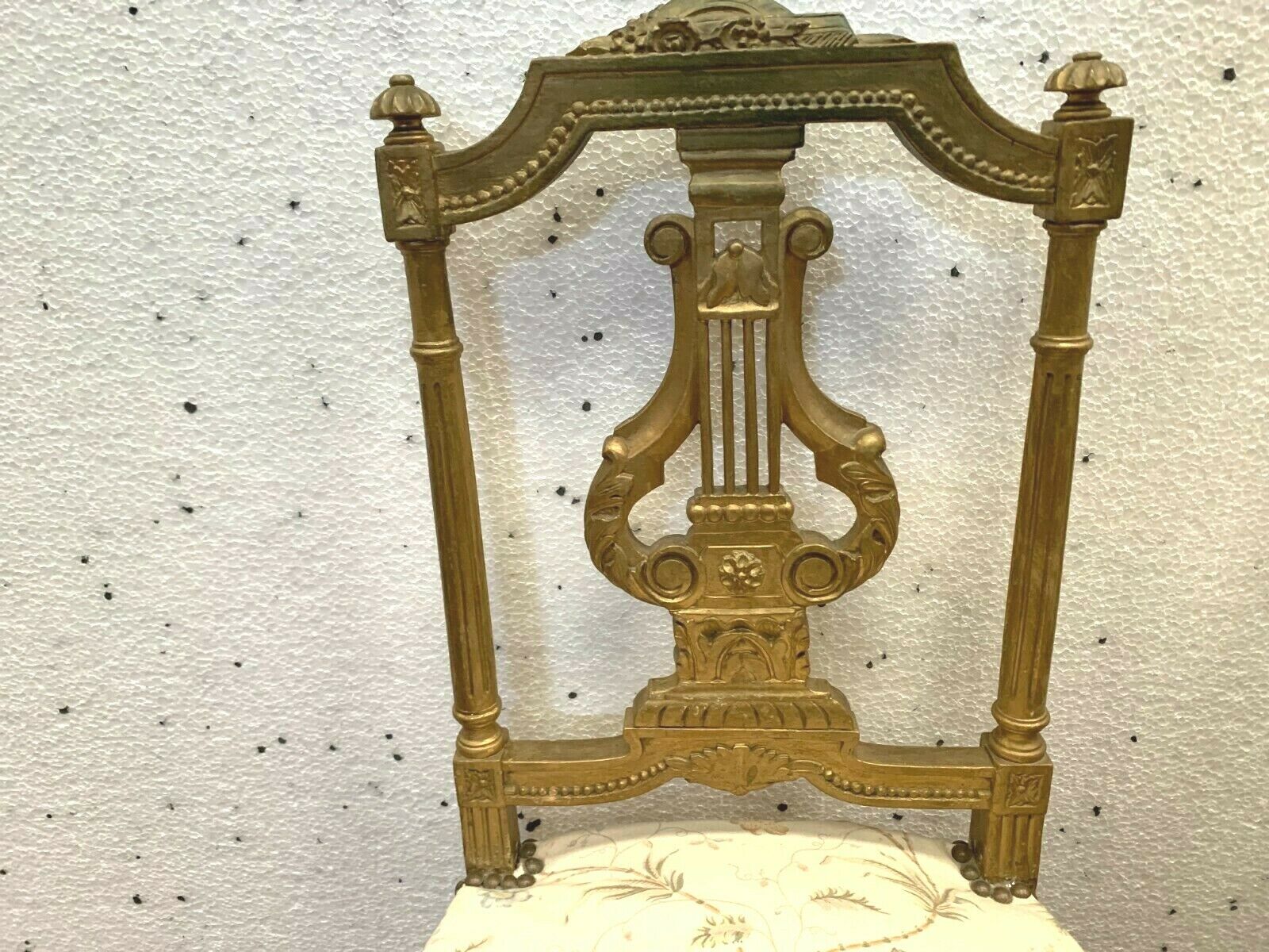 Pair of Louis XVI style chairs in 20th century gilded wood