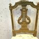 Paire de chaises de style Louis XVI en bois doré XX siècle