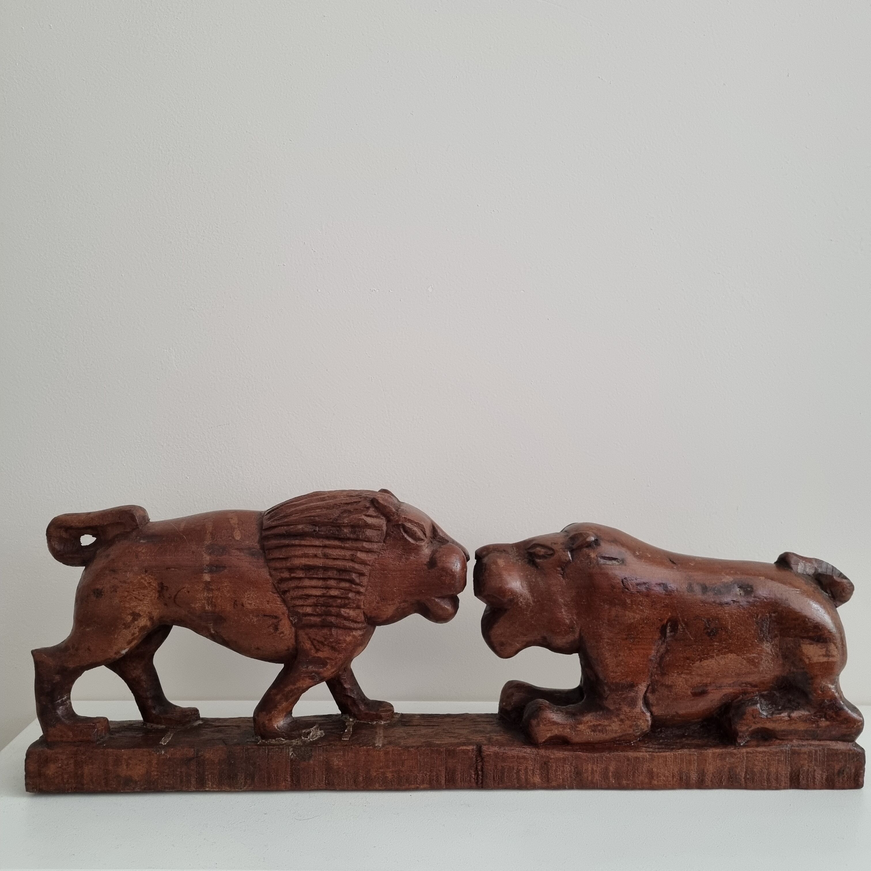 Lion and hippopotamus wood sculpture