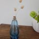 Small blue twisted glass bottle