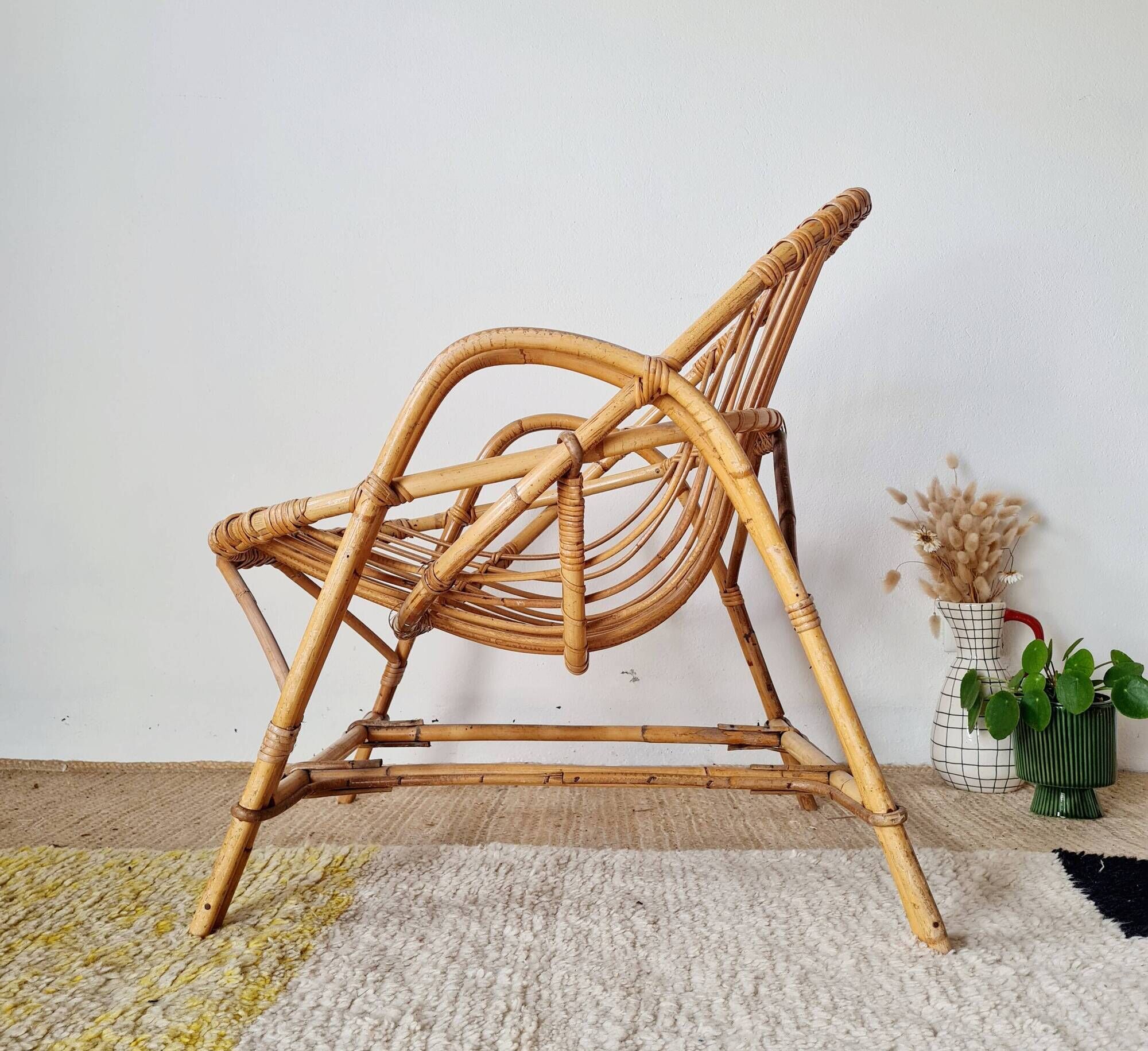 Vintage adult rattan armchair from the 1960s.